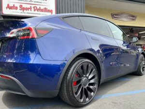 Blue Tesla Ceramic Coating Santa Rosa - Photo taken from the back of the vehicle showing ceramic coating services on paint, glass and wheels